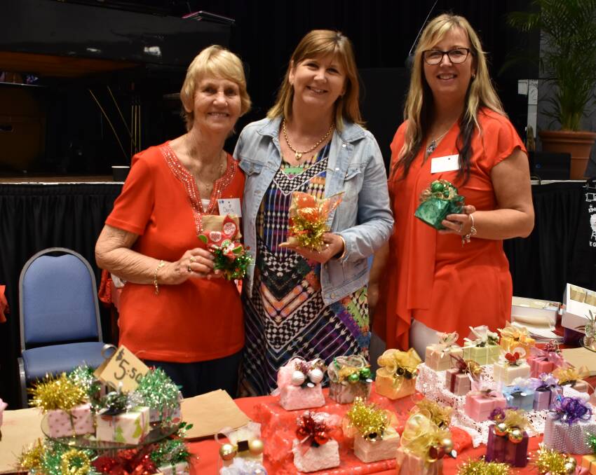 Gifts galore: Mum Doris Scott from Doris's Soap Creations with daughters Robyn Whitehead and Karyn Ellis at the 2018 Christmas Gift Fair.