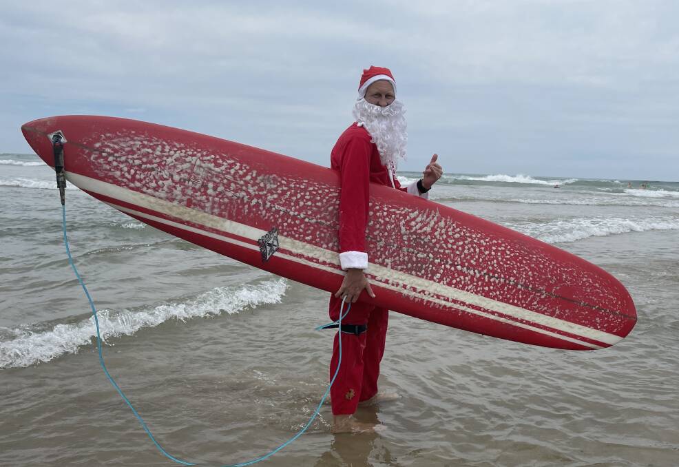 Surfing Santas at Rainbow Beach, pictures by Lisa Tisdell