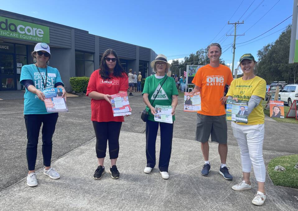 Marie van Gend, Michelle Thomas, Anne Carrick, Nathan Jamieson and Ilona Conaghan prepare to hand out how to vote flyers with pre-poll voting underway.