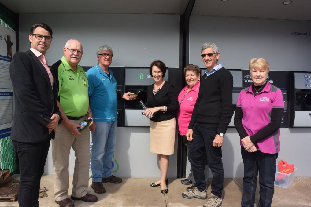 Community benefits: Port Macquarie MP Leslie Williams (centre) with Return and Earn local donation partner representatives Cody Boylan, John Hayes, Michael Jacobs, Leonie Heath, Malcolm McNeil and Leonie McWhirter.