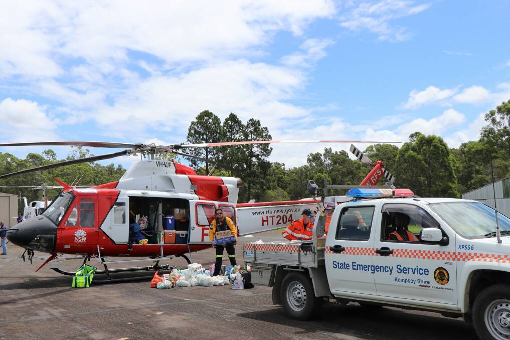 Vital service: The SES helps with the resupply of essential items to Bellbrook after a landslip. 