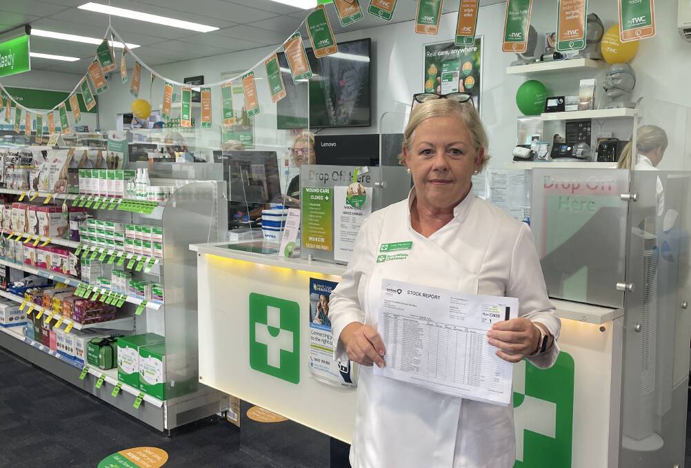 Community pharmacist Judy Plunkett holds a report detailing medications out of stock. Picture by Lisa Tisdell