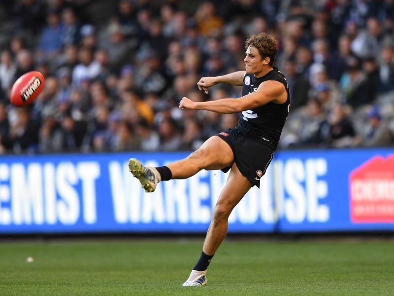 Carlton's Charlie Curnow will have knee surgery after injuring himself playing basketball.