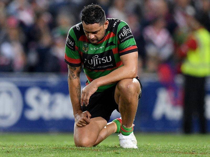 Rabbitohs star John Sutton slumps after his NRL side's preliminary final loss to the Roosters.