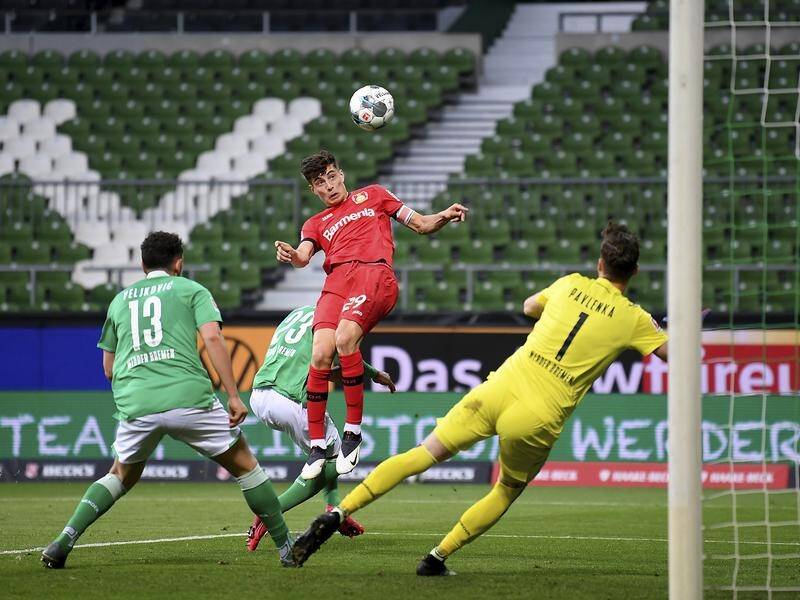 Leverkusen's Kai Havert (c) heads his first goal in the 4-1 Bundesliga win at Werder Bremen.