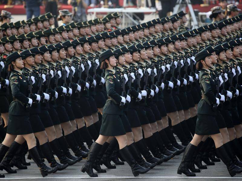 Female soldiers rehearse ahead of the Chinese republic's 70th anniversary parade.