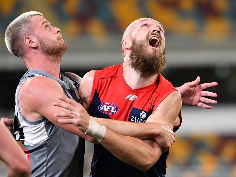 Melbourne coach Simon Goodwin wants umpires to do more to protect Max Gawn (right).