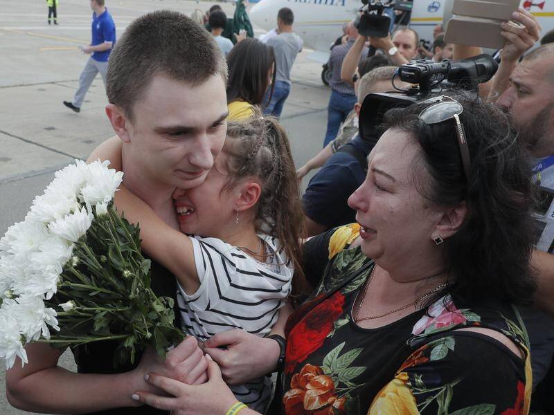 Dozens of Ukrainian prisoners who were released by Russia in a prisoner swap have landed in Kiev.