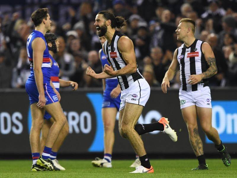 Collingwood have beaten the Western Bulldogs in their AFL match, with Brodie Grundy (C) starring.