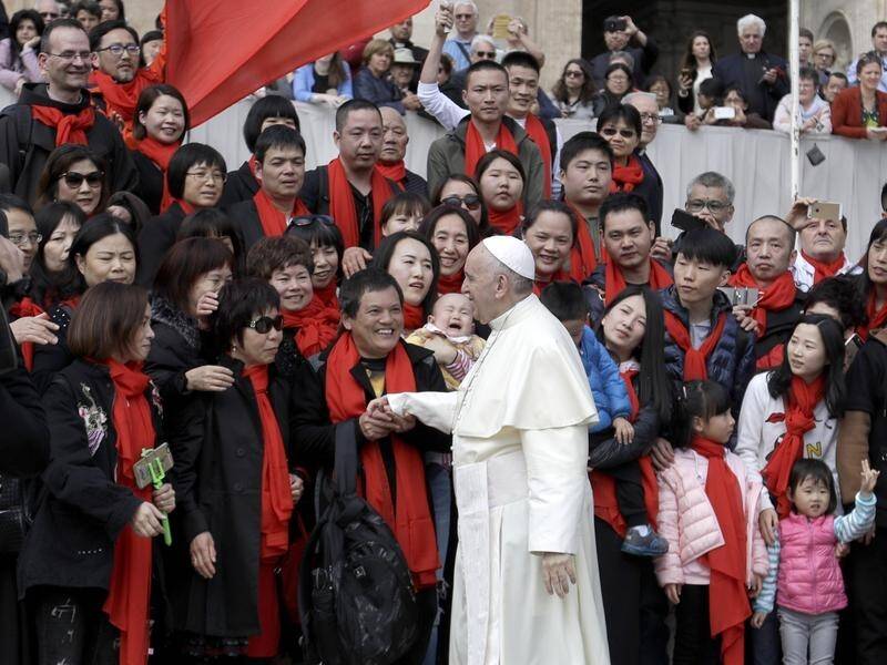 Pope Francis meets a group of faithful from China at the Vatican.