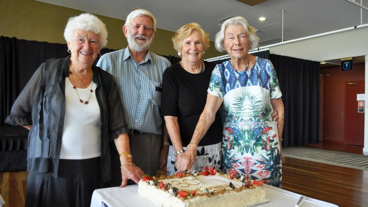 Special guests Norma Feller, Ray Innis, Beau Levitt and Ngaira Green cut the cake at Friday's 30th anniversary celebrations for the Camden Haven Bridge Club.