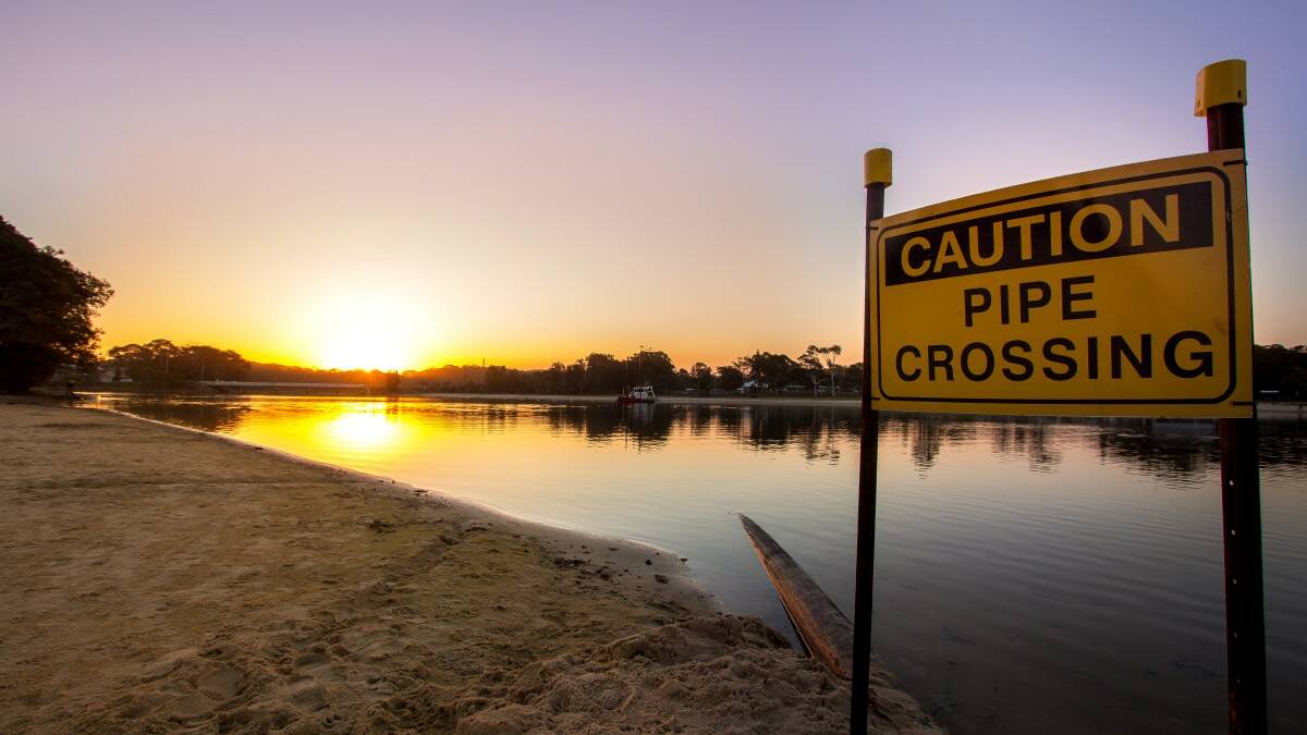 Take heed: A sign warns lake users about the dredging work. Pic: NATHAN DRAIN
