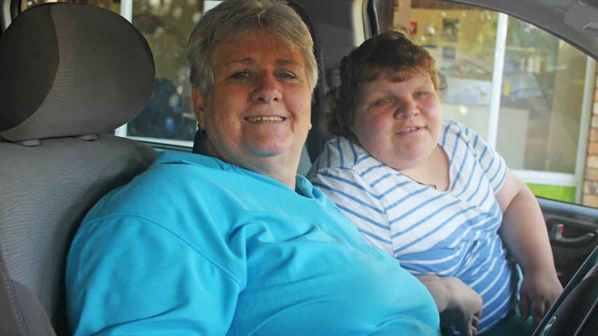 Volunteer driver Marilyn Northey understands the importance of donating her time so people like Carlie Culf (right) can access the support services ACES provides.
