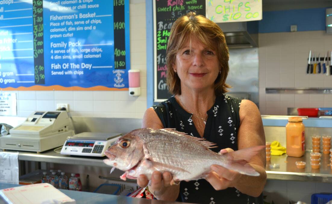 FRESH OPPORTUNITY: Gillian Beakey with one of the fresh local snapper at the Laurieotn Fisherman's Co-op.