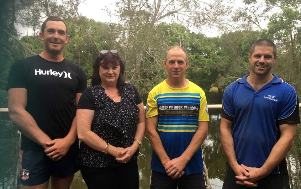 TEAM LEADING THE BLUES: Pictured from left, Beau Kettle (captain/coach), Carol Hardy (sponsor Kendall Services and Citizens Club), Wayne Wilkes (Blues president) and Dustin Prosser (assistant coach).