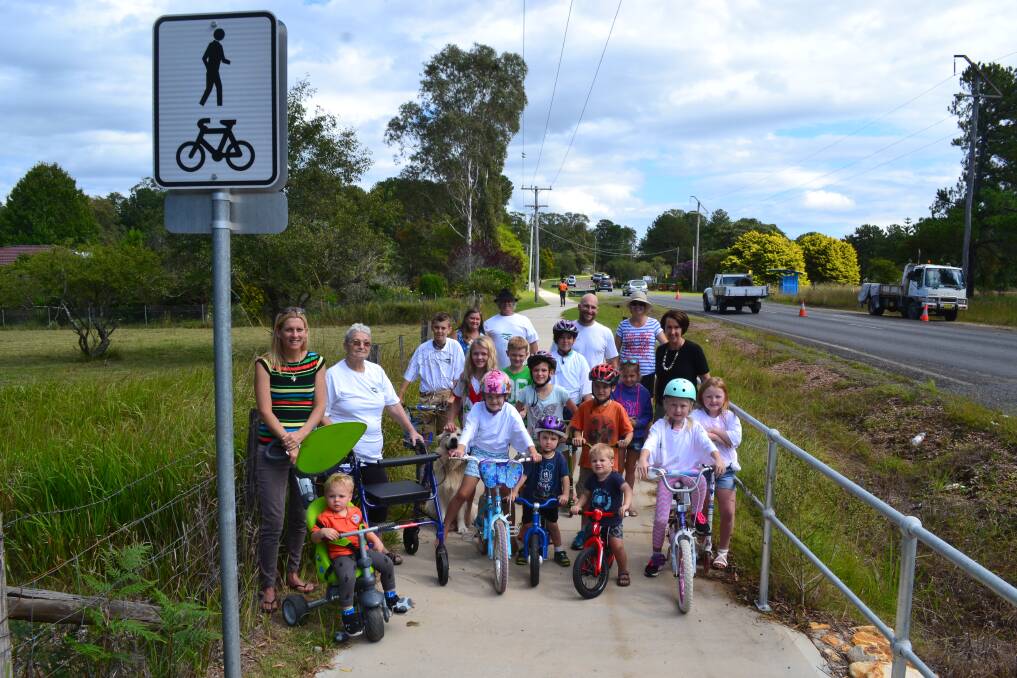 LET'S RIDE: The Schools to Schools committee and supporters with MP Leslie Williams enjoying one of the completed sections of the shared pathway.