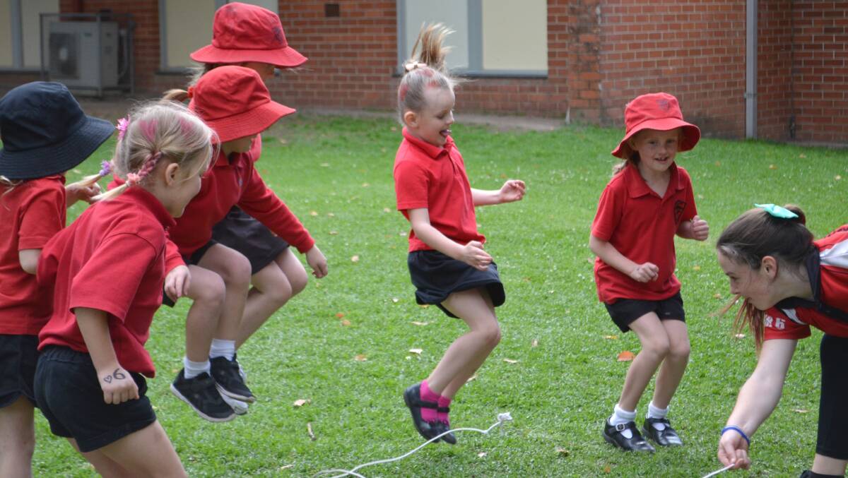 SNAKES: Abby leading Kindergarten and Year one girls in a jumping game.