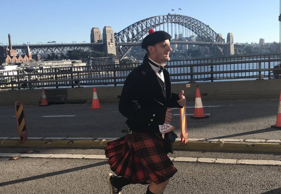 On the run: Keith Robinson and his kilt attempting to break the Guinness World Record. Photo: supplied