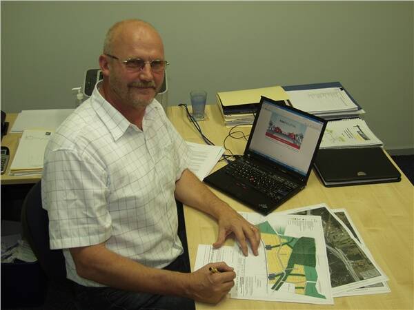 KI representative for developer Lawlor Services Pty Ltd (LSPL), Peter Newman, with plans of the Kew Industrial project